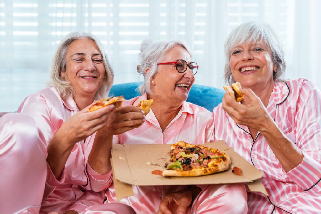 Elderly women in colourful pyjamas